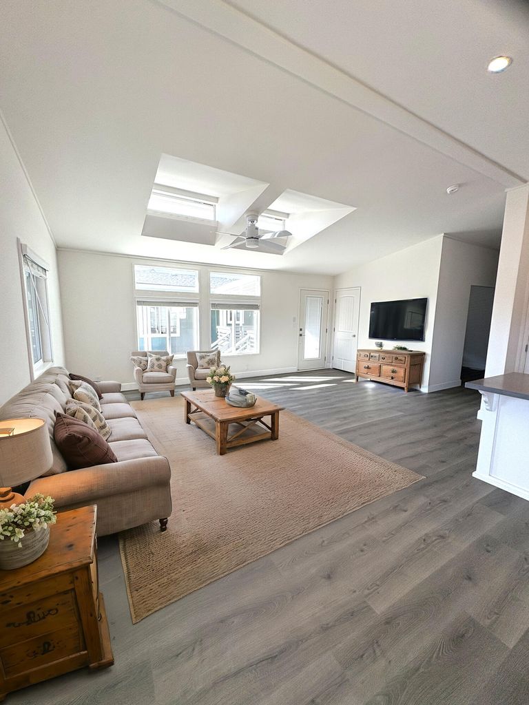  Virtually staged. Living and kitchen area. 