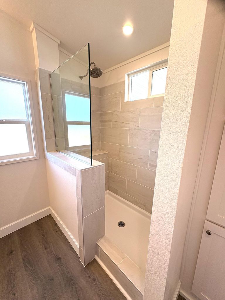  Primary walk in, with rain shower and window. 